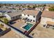Aerial view of two-story house with pool and landscaped backyard in a residential neighborhood at 30313 W Mitchell Ave, Buckeye, AZ 85396