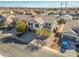 Aerial view of a two-story house with a driveway and landscaping in a quiet neighborhood at 30313 W Mitchell Ave, Buckeye, AZ 85396