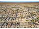 Aerial view of a residential area featuring houses, pools, and solar panels at 30313 W Mitchell Ave, Buckeye, AZ 85396