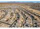 Aerial view of a suburban neighborhood with houses and a desert background at 30313 W Mitchell Ave, Buckeye, AZ 85396