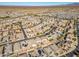 Aerial view of a residential neighborhood with numerous houses and pools at 30313 W Mitchell Ave, Buckeye, AZ 85396
