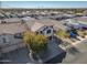 Aerial view of a two-story house with a driveway and landscaping in a residential area at 30313 W Mitchell Ave, Buckeye, AZ 85396