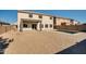 Backyard view of home with pool and firepit at 30313 W Mitchell Ave, Buckeye, AZ 85396