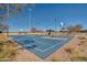 Outdoor basketball court with a hoop and seating area at 30313 W Mitchell Ave, Buckeye, AZ 85396