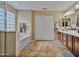 Double vanity bathroom with large soaking tub at 30313 W Mitchell Ave, Buckeye, AZ 85396
