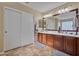 Bathroom with double vanity and large mirror at 30313 W Mitchell Ave, Buckeye, AZ 85396