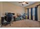 Home office with desk, two chairs, and window at 30313 W Mitchell Ave, Buckeye, AZ 85396