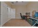 Spacious bedroom with desk, chairs, and access to hallway at 30313 W Mitchell Ave, Buckeye, AZ 85396