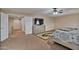 Bright Primary bedroom with dresser and large bed at 30313 W Mitchell Ave, Buckeye, AZ 85396