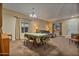 Charming dining room with a table, chairs, and large windows at 30313 W Mitchell Ave, Buckeye, AZ 85396