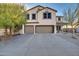 Two-story house with a two car garage and landscaping at 30313 W Mitchell Ave, Buckeye, AZ 85396