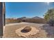 Stone firepit in a gravel backyard setting at 30313 W Mitchell Ave, Buckeye, AZ 85396