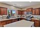 Modern kitchen with stainless steel appliances and an island at 30313 W Mitchell Ave, Buckeye, AZ 85396