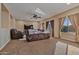 Spacious living room with a cozy seating arrangement and flat-screen TV at 30313 W Mitchell Ave, Buckeye, AZ 85396