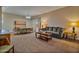Bright living room features a sofa, coffee table, and dining area at 30313 W Mitchell Ave, Buckeye, AZ 85396