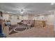 Cozy loft space featuring sectional sofa and built-in shelving at 30313 W Mitchell Ave, Buckeye, AZ 85396