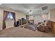 Relaxing loft with comfortable seating and a ceiling fan at 30313 W Mitchell Ave, Buckeye, AZ 85396