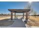 Covered picnic area with tables, benches, and a grill at 30313 W Mitchell Ave, Buckeye, AZ 85396