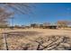 Sand volleyball court with nets, playground, and shaded seating area in the background at 30313 W Mitchell Ave, Buckeye, AZ 85396