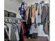 Spacious walk-in closet with ample hanging and shelf space at 30313 W Mitchell Ave, Buckeye, AZ 85396