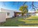 Backyard with grassy area and home view at 3126 E Monte Vista Rd, Phoenix, AZ 85008
