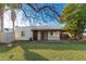 Backyard with grassy area and home view at 3126 E Monte Vista Rd, Phoenix, AZ 85008