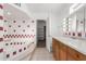 Bathroom with a large tub, wood cabinets and red tile accents at 3126 E Monte Vista Rd, Phoenix, AZ 85008