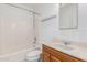 Clean bathroom with shower, bathtub, toilet, and wooden vanity at 3126 E Monte Vista Rd, Phoenix, AZ 85008