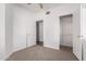 Bedroom with two closets and carpet flooring, leading to another room at 3126 E Monte Vista Rd, Phoenix, AZ 85008