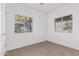 Bedroom with large windows overlooking the backyard and ceiling fan at 3126 E Monte Vista Rd, Phoenix, AZ 85008