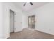 Bedroom with sliding glass door access to the backyard and a small closet at 3126 E Monte Vista Rd, Phoenix, AZ 85008