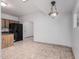 Kitchen features dark appliances and wood cabinets at 3126 E Monte Vista Rd, Phoenix, AZ 85008