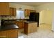 Spacious kitchen with island, ample cabinetry, and modern appliances at 3126 E Monte Vista Rd, Phoenix, AZ 85008