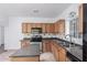 Modern kitchen with wood cabinets, a large island, and stainless steel appliances at 3126 E Monte Vista Rd, Phoenix, AZ 85008
