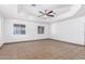 Large living area with tile flooring and neutral color palette at 3126 E Monte Vista Rd, Phoenix, AZ 85008