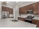 Modern kitchen with stainless steel appliances and white countertops at 3129 N 200Th Ave, Buckeye, AZ 85396