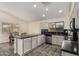 Modern kitchen with granite counters and stainless steel appliances at 3206 S 256Th Dr, Buckeye, AZ 85326