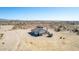 Aerial view of a single-story house with desert landscape at 3320 N 329Th Dr, Tonopah, AZ 85354