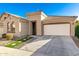 Single-story house with a two-car garage and nicely landscaped front yard at 3421 S Sunland Dr, Chandler, AZ 85248