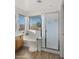 Bathroom with soaking tub, shower, and window at 3462 E Riopelle Ave, Gilbert, AZ 85298