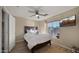 Guest bedroom with ceiling fan and window coverings at 3462 E Riopelle Ave, Gilbert, AZ 85298