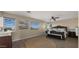 Spacious bedroom with large windows and ceiling fan at 3462 E Riopelle Ave, Gilbert, AZ 85298