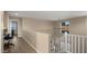 Upstairs hallway with a view of a home office and stairs at 3462 E Riopelle Ave, Gilbert, AZ 85298