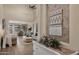 Inviting living room with high ceilings, stylish decor, and seamless flow to the dining area, ideal for modern living at 3462 E Riopelle Ave, Gilbert, AZ 85298