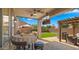 An outdoor patio featuring brick pavers, lounge furniture, a pergola, a ceiling fan, and a wall mounted TV at 3462 E Riopelle Ave, Gilbert, AZ 85298