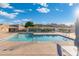 Community pool with lounge chairs and patio area at 3510 E Hampton Ave # 41, Mesa, AZ 85204