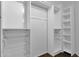 Large walk-in closet with shelves and drawers for ample storage at 3801 E Orchid Ln, Phoenix, AZ 85044