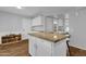 Kitchen with island and white cabinetry at 3801 E Orchid Ln, Phoenix, AZ 85044