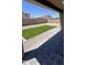 View of backyard highlighting the turf and patio area at 38133 W Vera Cruz Dr, Maricopa, AZ 85138