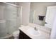 Bathroom featuring a glass-enclosed shower and a modern vanity with a white sink at 38133 W Vera Cruz Dr, Maricopa, AZ 85138